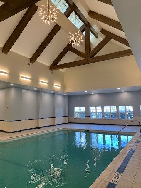 Updated Pool with Modern Lighting and Cathedral Ceilings